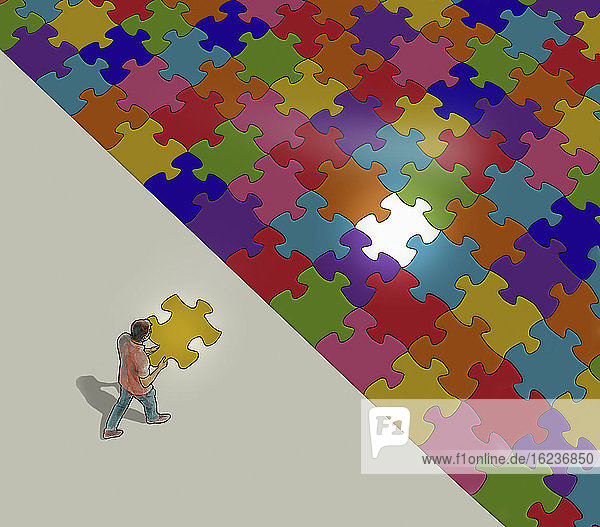 Mann mit dem letzten Puzzleteil