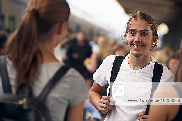 Smiling man on train station