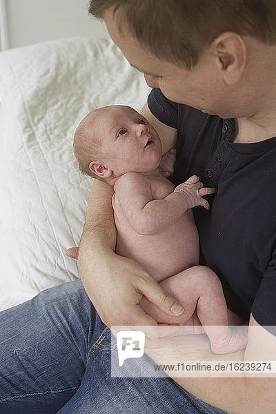 Father holding baby
