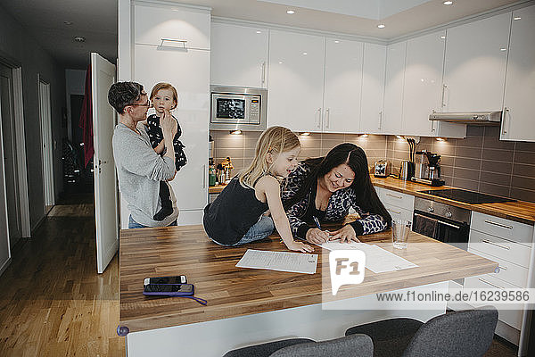 Parents with daughters in kitchen