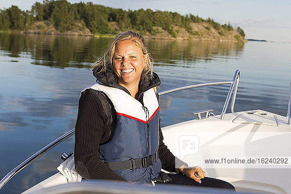 Smiling woman on boat