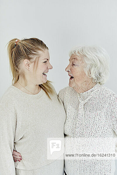 Grandmother with granddaughter  studio shot