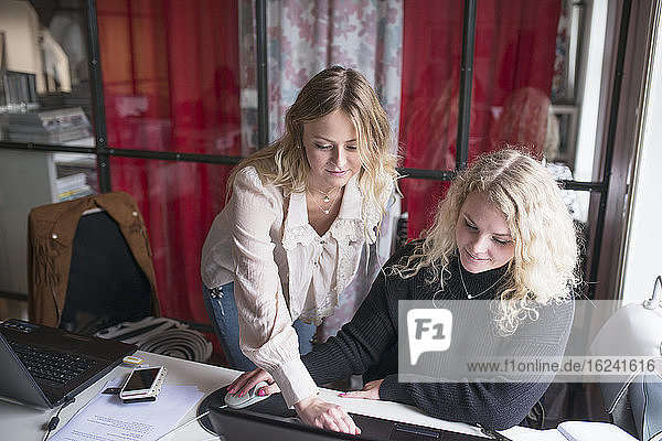 Women in office using laptop