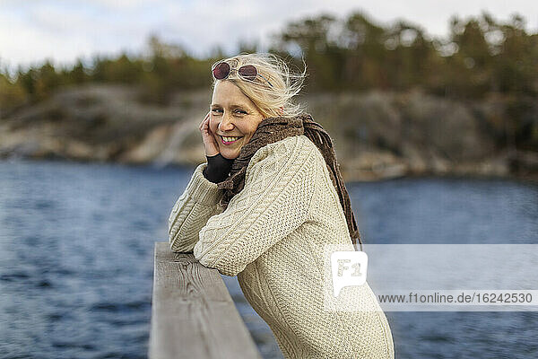 Smiling woman at lake