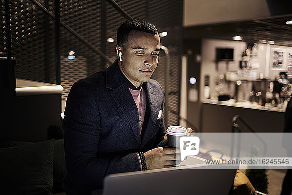 Young businessman working late