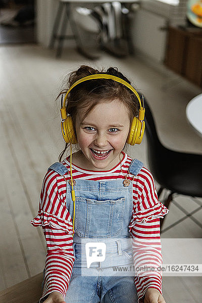 Happy girl wearing headphones