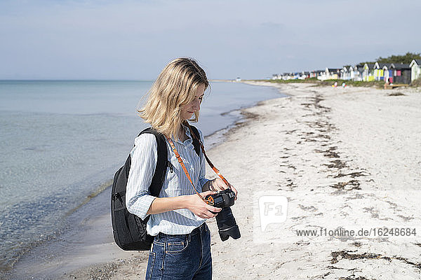 Woman on beach looking at camera