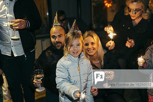 Parents with daughter at party