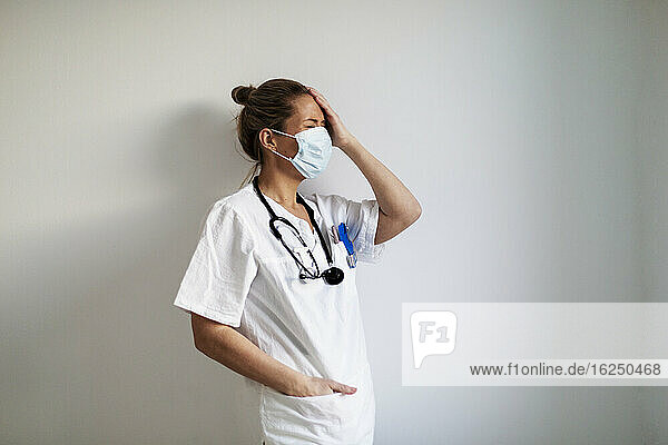 Female doctor wearing protective face mask