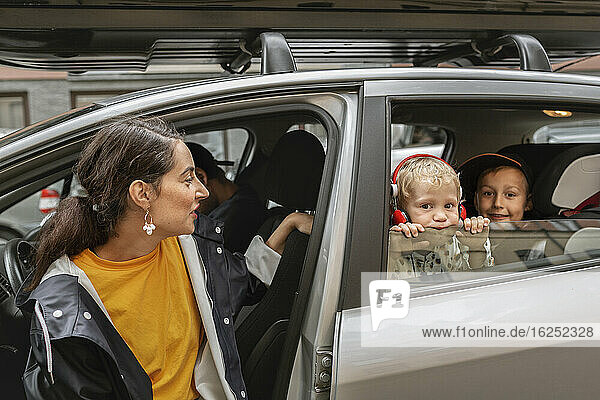Mother with sons in car