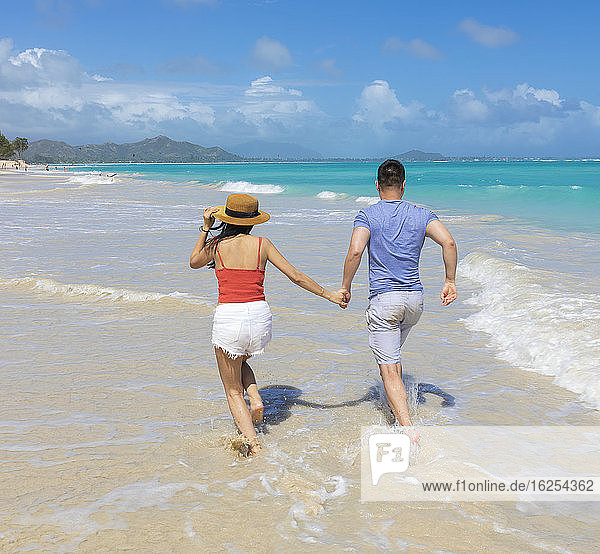 An Asian couple enjoying a vacation at Kailua Beach Park: Kailua  Oahu  Hawaii  United States of America