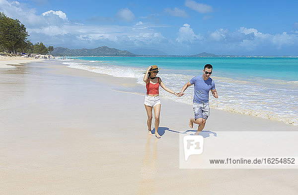 An Asian couple enjoying a vacation at Kailua Beach Park: Kailua  Oahu  Hawaii  United States of America