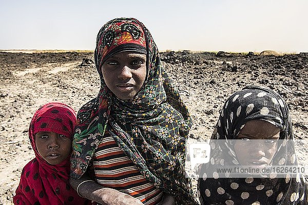 Afar nomads  children  working in the salt desert  Danakil depression  Afar region  Ethiopia  Africa