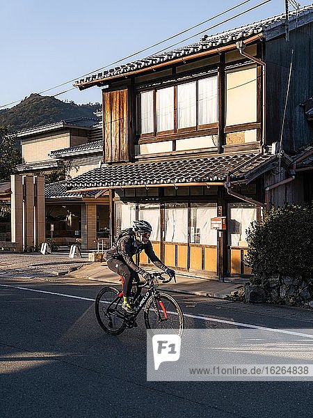 Cyclist in Kyoto  Japan  Asia