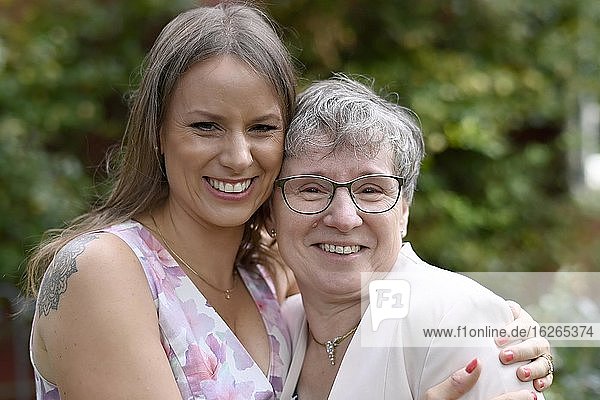 Young woman and older woman embrace each other  Generations  Karsruhe  Baden-Württemberg  Germany  Europe