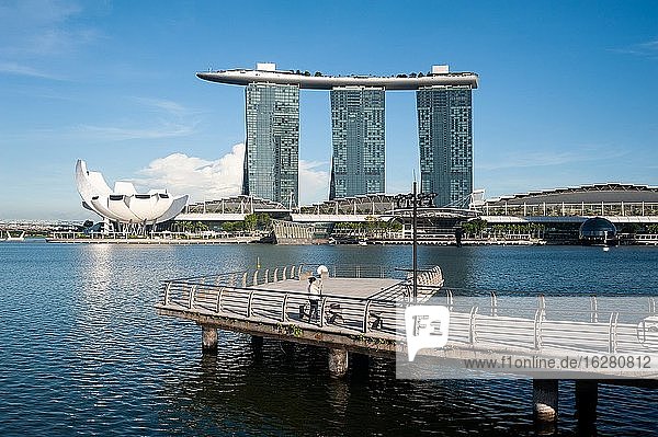 Singapore  Republic of Singapore  Asia - View from Merlion Park across the Singapore River with the ArtScience Museum and the Marina Bay Sands Hotel along the waterfront.