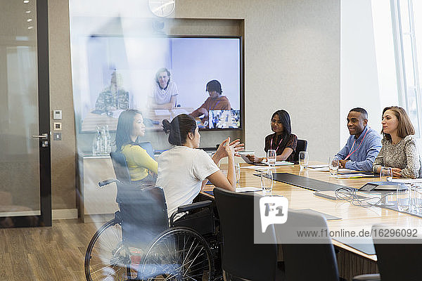 Business people talking and video conferencing in conference room