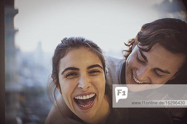 Close up portrait laughing young couple