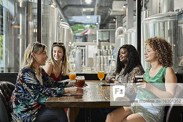 Female friends socializing in a pub