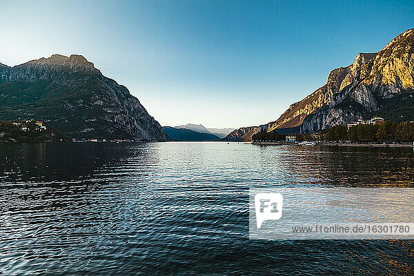 Idyllic scene of Lake Como against clear sky during sunset