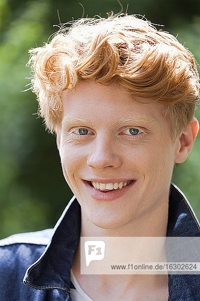 Germany  Bavaria  Munich  Portrait of young man  smiling  close up