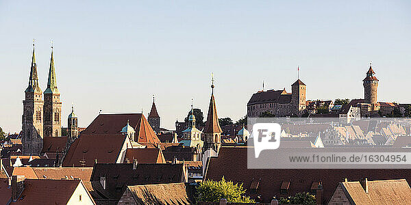 Germany  Bavaria  Nuremberg  Clear sky over historical old town at dusk