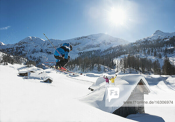 Austria  Salzburg  Young man ski jumping in mountains