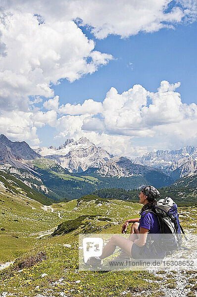 Italy  South Tyrol  Dolomites  Fanes-Sennes-Prags Nature Park  hiker sitting in alpine meadow
