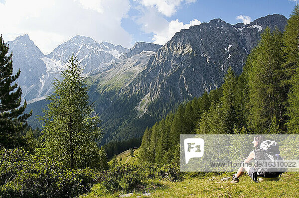 Italy  South Tyrol  Puster Valley  Antholz-Obertal  Staller Saddle  Hiker looking at Antholz Valley