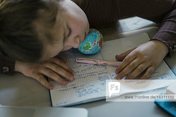 Girl napping while studying on table