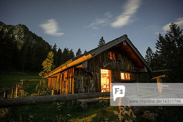 Secluded mountain hut at dusk
