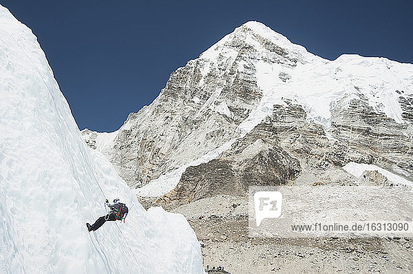 Climber using rope on mountain  Everest  Khumbu region  Nepal