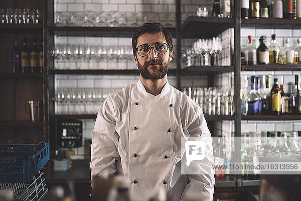 Portrait of confident male chef in commercial kitchen
