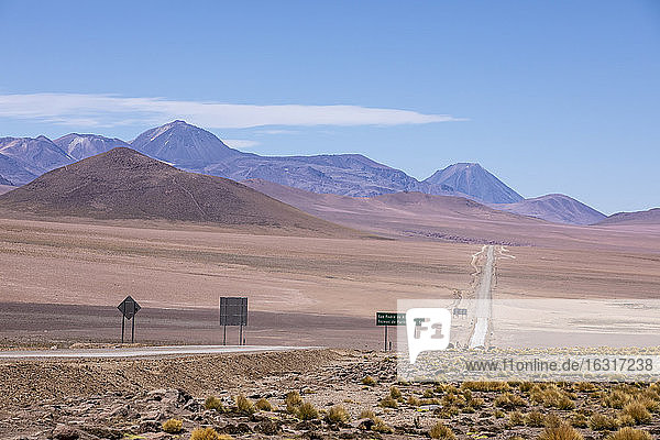 Highway going through stratovolcanoes in the Andean Central Volcanic Zone  Antofagasta Region  Chile  South America