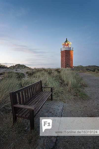 Cross light  lighthouse with sand dune in the evening light  Kampen  Sylt  Germany  Europe