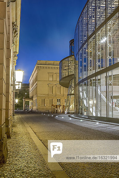 Germany  Berlin  narrow cobblestone street between historic and modern facades of German Historic Museum