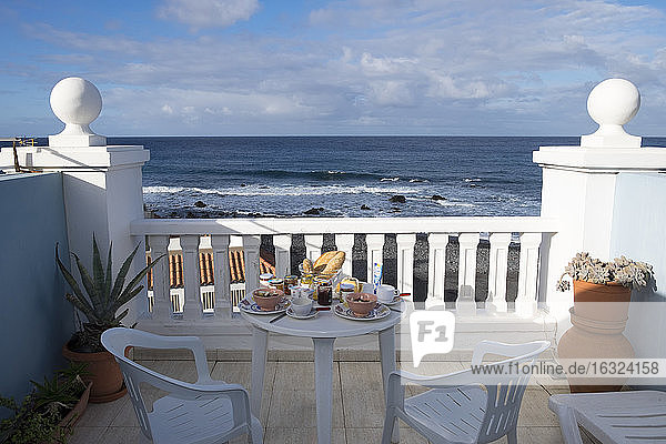 Spain  Canary Islands  La Gomera  laid breakfast table on roof terrace