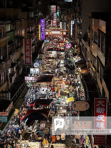 Busy pedestrian area at night  night market Raohe Night Market  Songshan District  Taipei  Taiwan  Asia