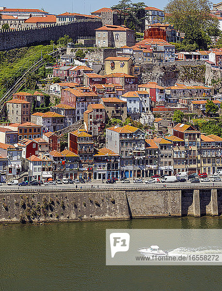 Porto  Porto District  Portugal. View across Douro River from Vila Nova de Gaia to Ribeira district. Porto is known as Oporto in English. The historic centre of the city is a UNESCO World Heritage Site.