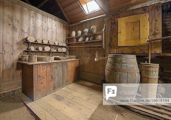 Interior view of a butter production with butter barrel butter tub butter moulds on the wall on a peat farm sod house settlement Grenjadarstadur Grenjaðarstaður Þingeyjarsveit Norðurland eystra Iceland Europe