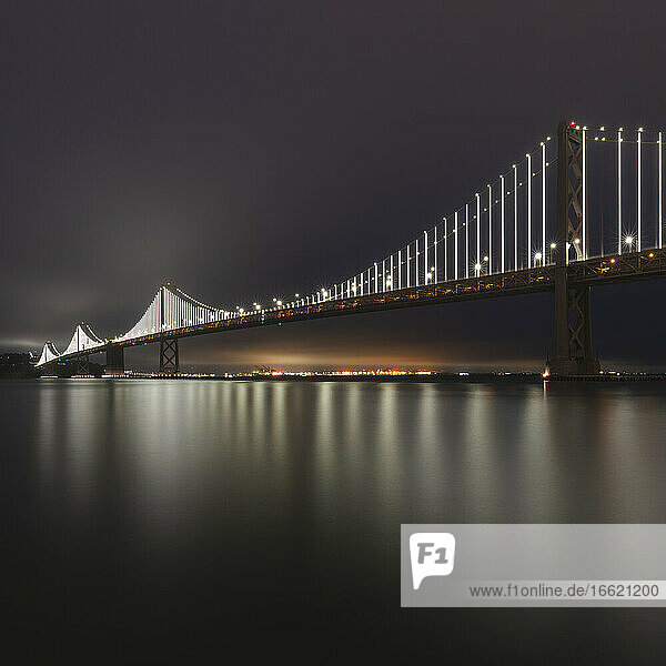 Illuminated Oakland Bay Bridge at night in San Francisco  California  USA