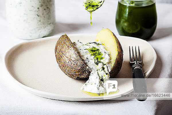 Baked potato with herb quark and homemade ramson oil