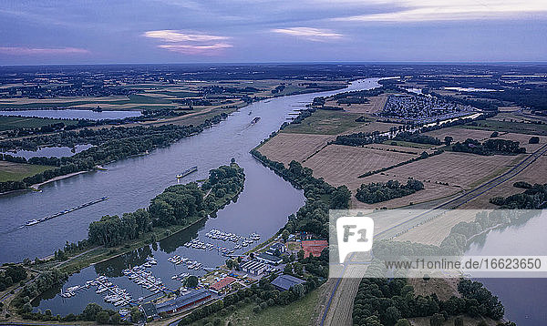 Germany North Rhine-Westphalia Wesel Aerial view of harbor on Wesel-Datteln Canal at dusk