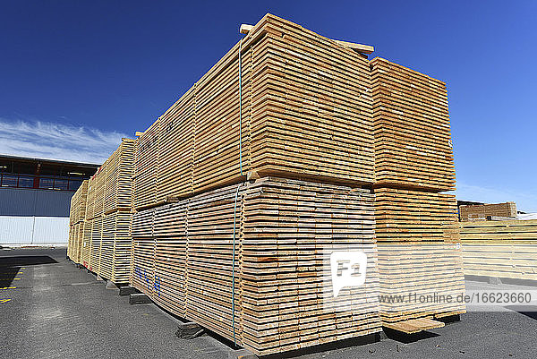 Planks stacked in lumberyard