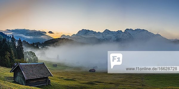 Sunrise and morning fog  Geroldsee  behind it the Karwendel Mountains  Werdenfelser Land  Upper Bavaria  Bavaria  Germany  Europe
