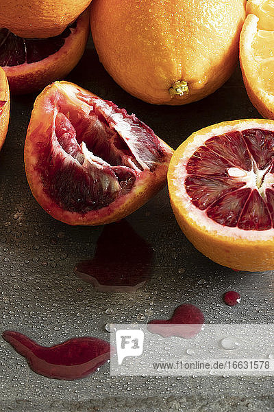 Oranges and blood oranges  partially juiced