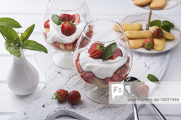 Vegan strawberry tiramisu with yoghurt cream in glasses