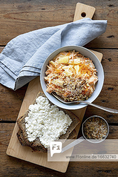 Carrot salad and rye bread with cottage cheese