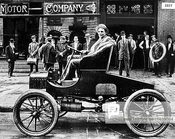 Detroit  Michigan  1908
Auto maker Henry Ford sits in a new Model T outside his plant.