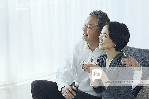 Japanese Senior Couple In The Room